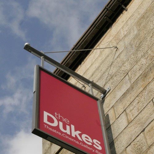 photo of the the dukes sign hanging from the wall